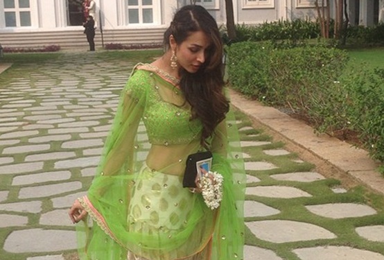 Malaika Arora Khan in Off White Green Lehenga Choli at Arpita’s Wedding Place in Hyderabad's Falaknuma Palace