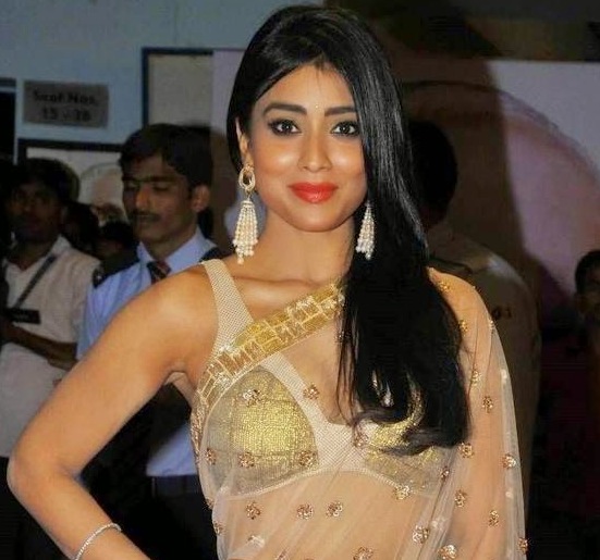 Shriya Saran in White Transparent Saree Pics at Manam Movie Premiere Show