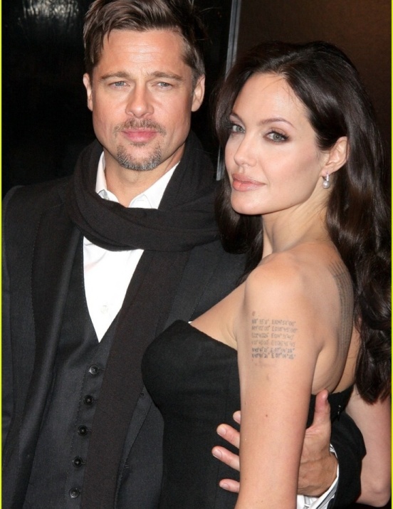 Cool Tattoos on Cute Arms and Hot Body of Angelina Jolie wearing Strapless Cleavage Exposing Black Dress Evening Gown