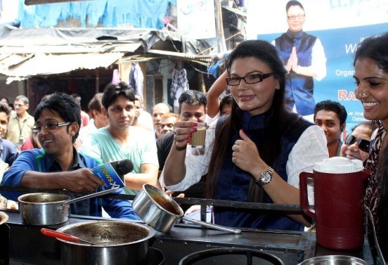 Hot Bollywood Item Girl Indian Actress Rakhi Sawant in White Kurta Pyjama distributes FREE Dustbins in Mumbai Streets