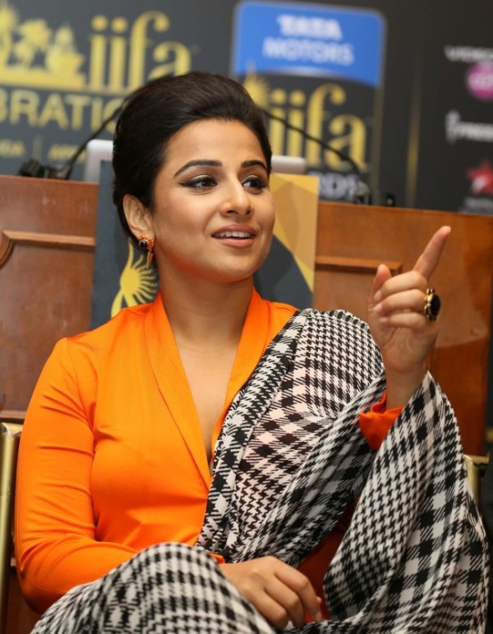 Vidya Balan in Orange Cleavage Exposing Dress during IIFA Awards 2014 Press Conference at New York in USA