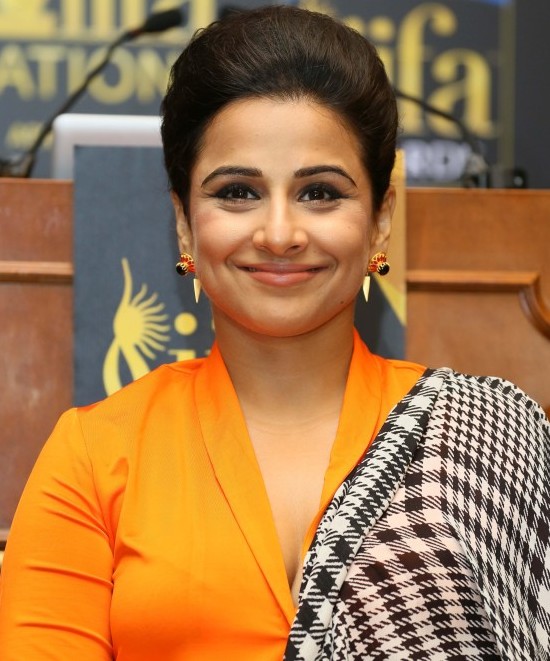 Vidya Balan in Orange Cleavage Exposing Dress during IIFA Awards 2014 Press Conference at New York in USA